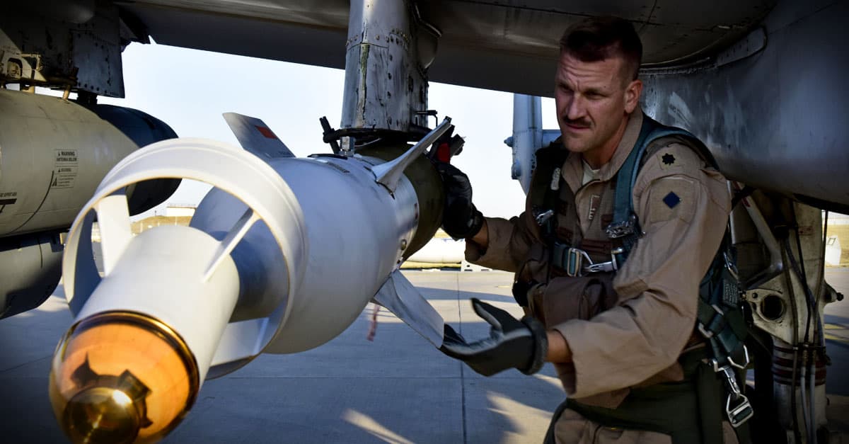 A-10_ Support Squadron commander conducts a preflight munitions check on an A-10 Thunderbolt II