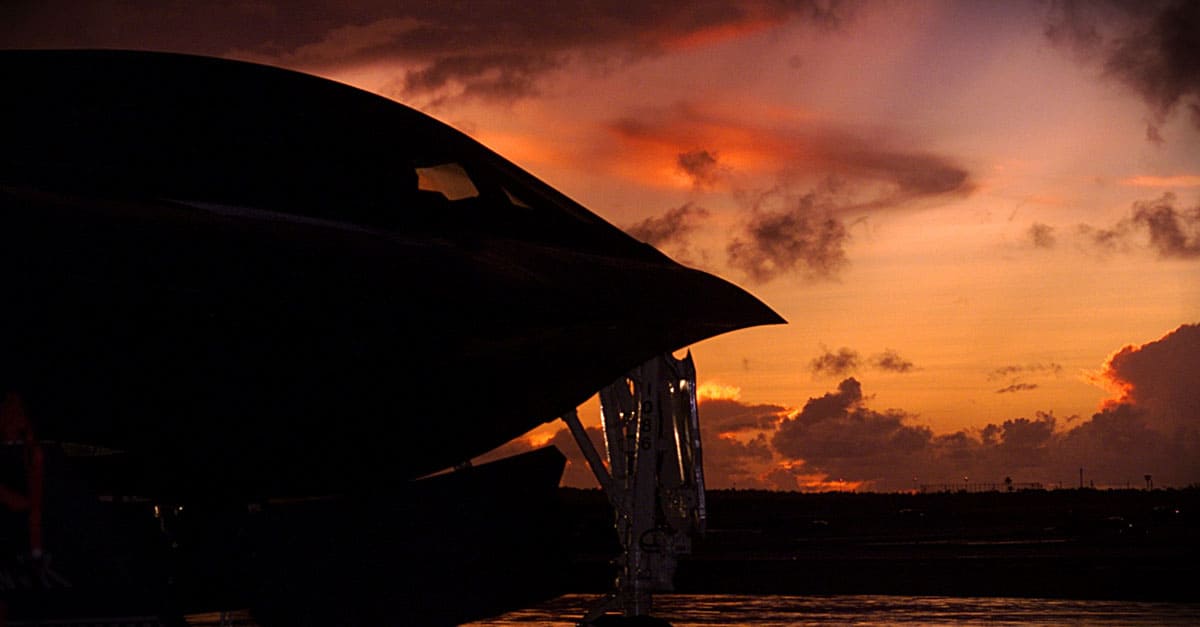 B-2-A B-2 Spirit bomber from Whiteman Air Force Base, Mo., is silhouetted by a Pacific sunset