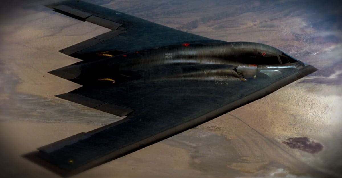 B-2- A B-2 Spirit flying over landscape
