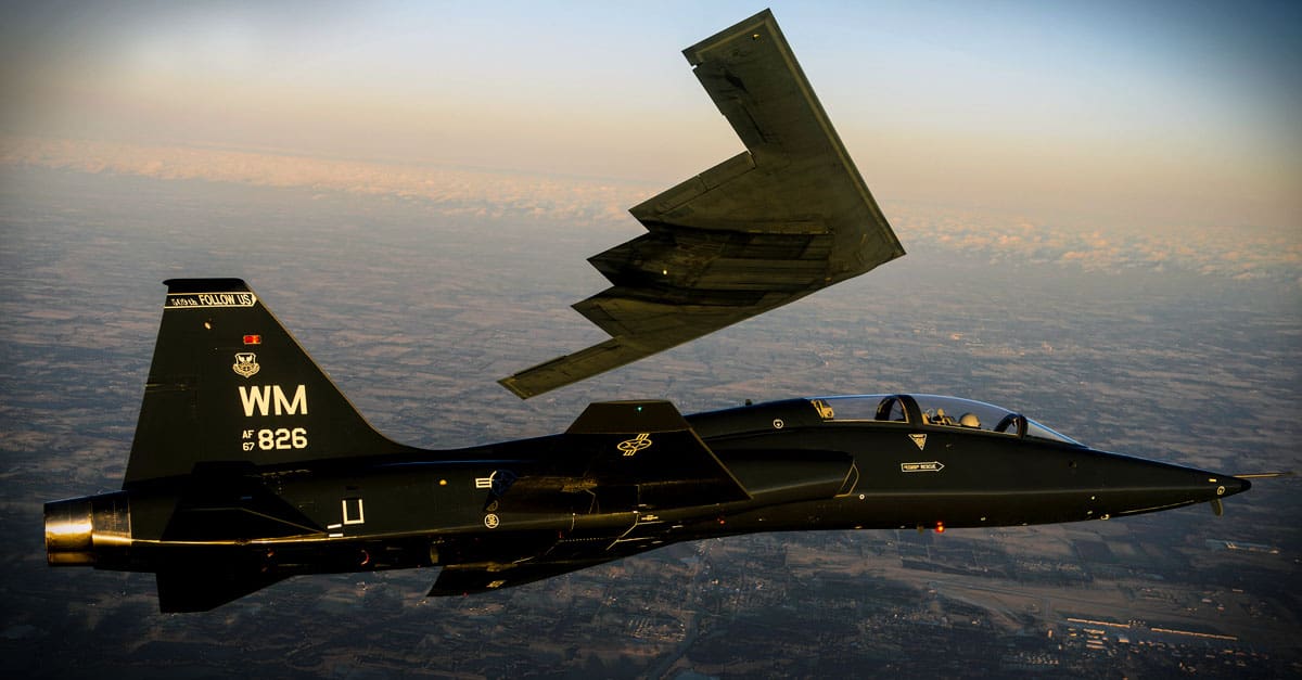 B-2_A T-38 Talon flies in formation with the B-2 Spirit