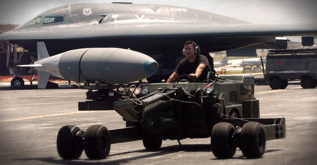 B-2_Senior Airman Phillip Ruiz moves a bomb to be loaded onto a B-2 Spirit bomber