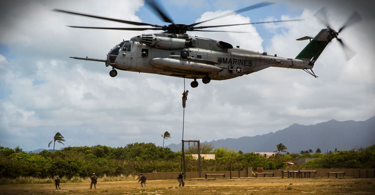CH-53E_ Marines fast rope out of a CH-53E Super Stallion aboard Marine Corps Base Hawaii
