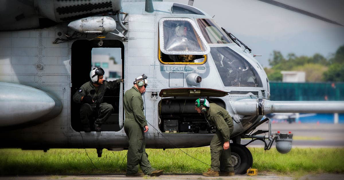 CH-53E_Marines check over their CH-53E Super Stallion helicopter before departing La Aurora