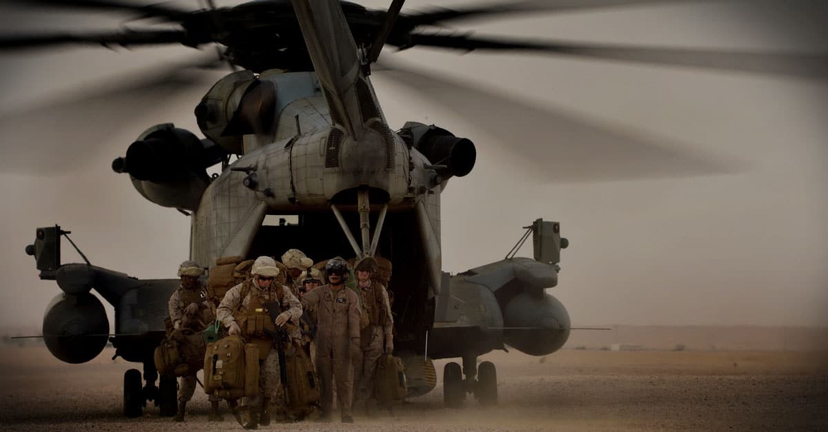 CH-53E_Marines offload from a Marine CH-53 Super Stallion helicopter